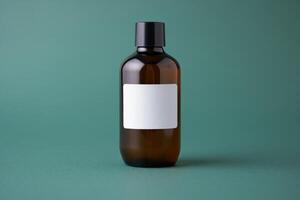 A brown bottle with a white label on a green background photo