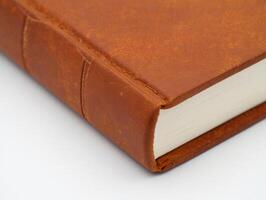 A close up of a brown leather book photo