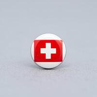 Swiss Flag Ball on White Surface photo