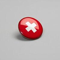 A red button with a white cross on it photo