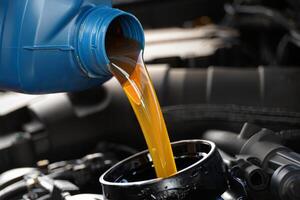 A blue liquid pouring from a car engine photo