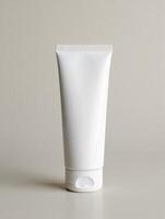 A tube of white cream on a table photo