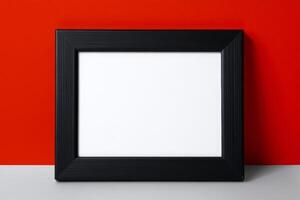 Black frame on red wall with white background photo