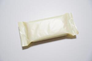 A white plastic bag with a white wrapper photo