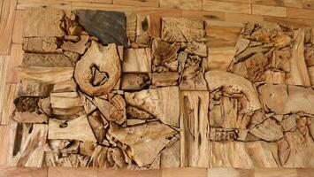 A wooden wall with various pieces of wood photo