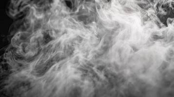 Abstract swirling white smoke on dark background. photo