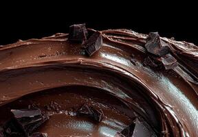 Delicious chocolate frosting with chocolate chunks photo