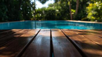 A wooden table situated next to a swimming pool photo