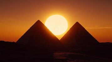 Pyramids in the desert at sunset photo