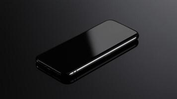 A black phone sitting on a black surface photo