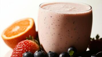 A smoothie with berries and oranges on a table photo