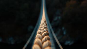 A bungee cord hanging from a towering bridge photo