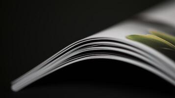 A close up of a magazine with a green plant photo