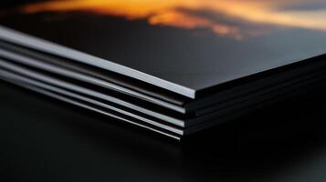 A stack of books with a photo of a sunset