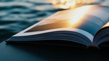 An open book on a table with the sun shining photo