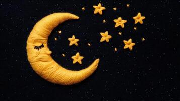A yellow crescent with stars on it photo