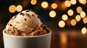 A bowl of ice cream with cookies and chocolate chips photo