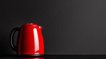 A red kettle on a black table photo