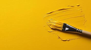 Yellow Paint, Paintbrushes, and Pastel Paint Background photo