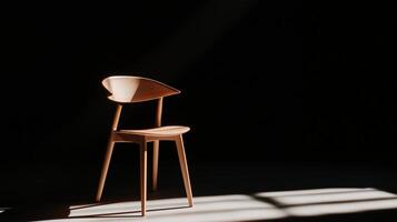 A chair in the dark with the sun shining through photo