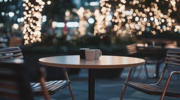 Empty Cafe Table and Chairs with Bokeh Lights photo