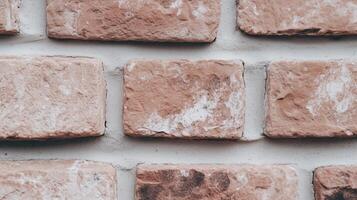 A close up of a brick wall with white paint photo