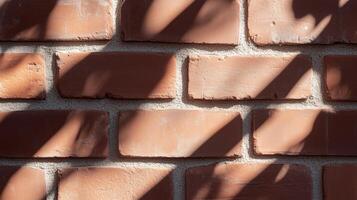 A close up of a brick wall with shadows photo