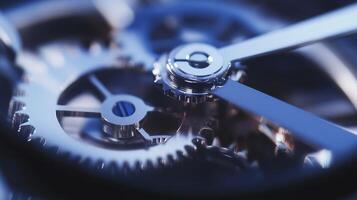 Blue mechanical gears interlocked on a smooth surface photo