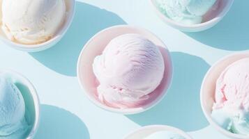 A group of colorful ice cream scoops on a blue surface photo