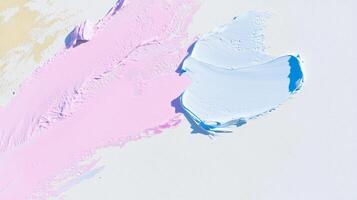 A blue and pink paint splatter on a white surface photo