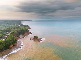 A view of the ocean and a small island photo