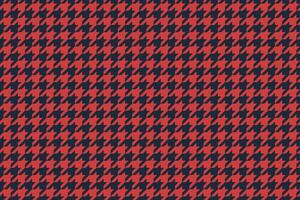 Vibrant red and navy houndstooth pattern. Classic yet modern textile design perfect for fashion, website backgrounds, or print projects. vector