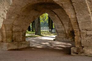Exploring the tranquil pathways of the Great Catherine Palaces serene gardens and arches in late afternoon light photo