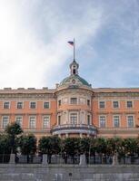 Historic building with Russian flag in Saint Petersburg under a clear sky during the day photo