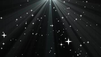 Shining Light Rays with Sparkling Stars in a Dark Background video