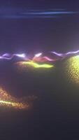 Vibrant waves of particles form glowing terrain under dynamic neon light streaks in a surreal digital landscape video