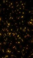 Abstract glowing particles floating in darkness, creating a dynamic and ethereal light field video
