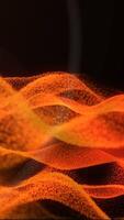 Abstract waves of glowing orange particles forming dynamic fluid shapes over a dark background video