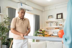 Man playing rolling ball for practice balance and concentrate at home photo