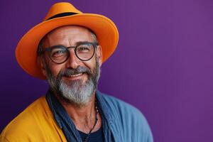Smiling man with glasses wearing colorful hat photo
