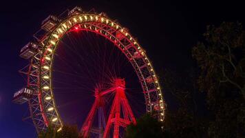 The famous Prater wheel in Prater, an amusement park in central Vienna. Time lapse clip at night video