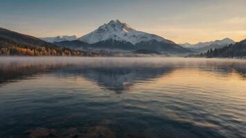 Serene Alpine Lake at Dawn Majestic Snow-Capped Mountains Reflected in Calm Waters under a Soft, Golden Sky, with a Touch of Mystical Fog. photo
