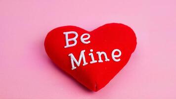 Red Heart Pillow With Be Mine Text photo