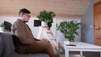 man playing games using controller at home video