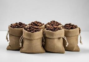 Six Small Burlap Sacks Filled with Coffee Beans photo