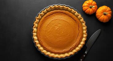 Pumpkin Pie and Mini Pumpkins - Top View photo