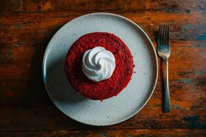 Top view of red velvet cake and whip cream on plate photo