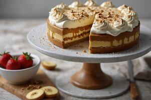 Caramel cake with whithe cream on top on the stand photo
