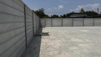 Concrete Wall Boundary A study of a constructed concrete wall in an open outdoor space. Emphasizing on security, protection, and structure. photo