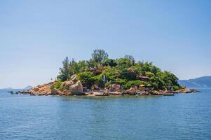View of the Tu Ton Pagoda Island in Nha Trang. Buddhist temple on an island in the middle of the sea in Asia. photo